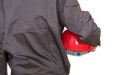 Arm with red hard hat facing away from the camera Royalty Free Stock Photo