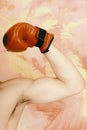 Arm with strong biceps wearing red leather boxing glove Royalty Free Stock Photo