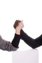 Arm wrestling between a black man and white woman