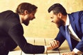 Arm wrestling of businessman and aggressively compete man