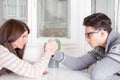 Arm wrestling challenge between a young couple Royalty Free Stock Photo