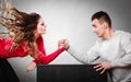 Arm wrestling challenge between young couple Royalty Free Stock Photo