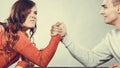 Arm wrestling challenge between young couple Royalty Free Stock Photo