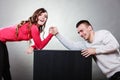 Arm wrestling challenge between young couple Royalty Free Stock Photo