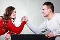 Arm wrestling challenge between young couple Royalty Free Stock Photo