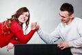 Arm wrestling challenge between young couple Royalty Free Stock Photo