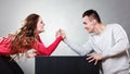 Arm wrestling challenge between young couple Royalty Free Stock Photo