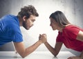 Arm wrestling between a couple Royalty Free Stock Photo