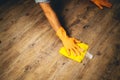 arm from young man clean the floor with yellow cloth Royalty Free Stock Photo