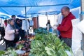 Locals shopping fruit and vegetables at market in Armacao de Pera
