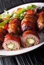 Armadillo eggs are a classic Texas BBQ staple served with salad close up on a plate. vertical Royalty Free Stock Photo