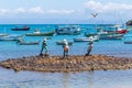 Buzios, Rio de Janeiro. The bronze sculpture Three fishermen placed in the bay of buzios.