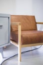 armchair, chair, individual sofa, solid natural wood structure, seat and back in natural leather Royalty Free Stock Photo