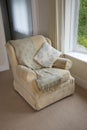 Armchair with cushion and shawl