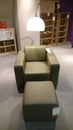 Armchair, reading lamp and book shelves