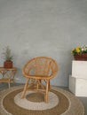 armchair on a round carpet on a gray background