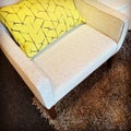 Armchair with yellow cushion