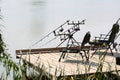 Armchairs with fishing tackle on pier Royalty Free Stock Photo