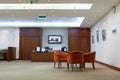 Armchairs, table and reception in office