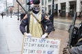 Armed Demonstrator Holds a Sign at the Ohio Statehouse Ahead of Biden`s Inauguration