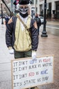 Armed Demonstrator Holds a Sign at the Ohio Statehouse Ahead of Biden`s Inauguration