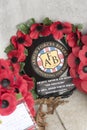 Armed Forces poppy wreath laid on a memorial