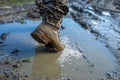 Armed Forces of Ukraine. Ukrainian soldier. Brown military boots on mud and puddle