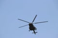 Armed Helicopter flying around the blue sky crisp shot