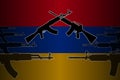 Armed, military conflict and confrontation in Armenia - silhouettes of crossed assault rifles