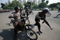 Armed police jump from motorcycle