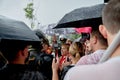 Armed police stand to disperse protesters in the rain