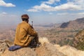 Armed ranger seated in the Simien national park Royalty Free Stock Photo