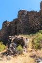 Armenia, Amberd, September 2022. A fragment of the wall and the ruins of the towers of the old fortress.