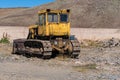 Armenia, Aragats, September 2022. Powerful vintage bulldozer in the parking lot, rear view.