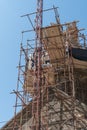 Armenia, Geghard, September 2021. Workers on the scaffolding, restoration of the temple.