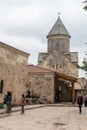 Armenia, Haghartsin, September 2021. Tourists in the courtyard of an ancient monastery.