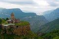 Armenia`s landmark Tatev Monastery on a cliff of a cliff against the backdrop of high picturesque