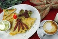 Breakfast with scrambled eggs, coffee and toast.