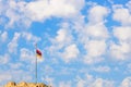 Armenian flag on pole with cross on top of hill Royalty Free Stock Photo