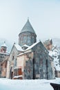 Armenian monastery Geghard, a church yard, pavement and trees co