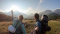 Armentarola - A couple enjoying an early morning in Italian Dolomites. The valley below is shrouded in morning haze