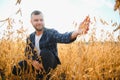 armer inspects soybeans before harvesting. The concept of agricultural industry