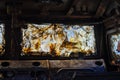 Armor piercing glass of damaged and burned military infantry fighting vehicle during the war between russia and Ukraine.