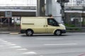 Armored encashment truck Ford Transit is driving in the city street