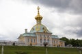 Armorial housing of Grand Palace in Peterhof. Cloudy, rainy weather in Peterho