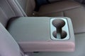 Armrest in the car with cup holder for rear seats row Royalty Free Stock Photo