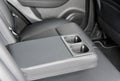 Armrest in the car with cup holder for rear seats row Royalty Free Stock Photo