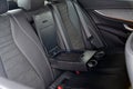 Armrest in the car with cup holder for rear seats row Royalty Free Stock Photo