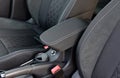 Armrest in the luxury passenger car between the front seats Royalty Free Stock Photo