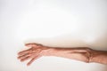 Arms and hands of the elderly man on a white background Royalty Free Stock Photo